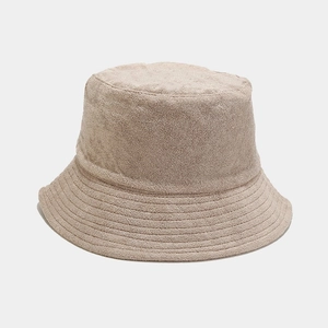 Close-up of beige terry cloth bucket hat showing high-quality fabric texture and stitching
