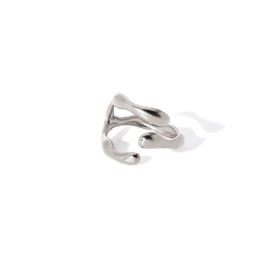 Macro shot of silver polished irregular fluid open ring with sleek organic shapes
