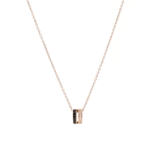 Rose gold stainless steel double ring necklace with sparkling crystals on white background