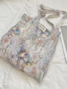 Floral lace tote bag in lavender with orange flowers and frayed edges by DEHAKKA STUDIO