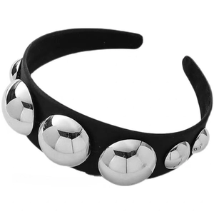 Fashionable black headband with large reflective silver metallic studs on a white background
