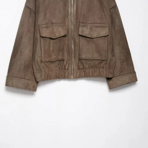 Classic dark brown suede jacket featuring front flap pockets and elastic hem details