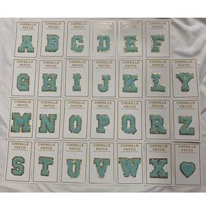 Detail of 26 blue chenille alphabet patches with gold sequins and peel and stick adhesive