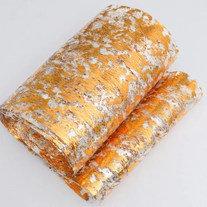 Detailed texture of gold and silver foil table runner for elegant wedding decoration