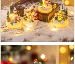 Miniature Christmas resin village house with LED lights and glowing festive snow scene