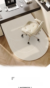Detail view of a waterproof round office chair mat with beige geometric line patterns