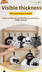Detail of coral fleece Halloween hand towels with soft texture and cartoon shapes