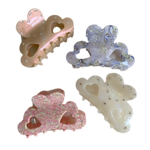 Elegant heart-shaped acetate hair claws set with rhinestones in four marble colors