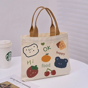 Mini canvas handbag in beige with colorful cartoon bear patterns and brown woven handles