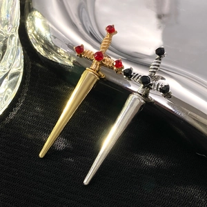 Gothic sword brooches in gold with red ruby and silver with black gemstone accents