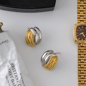 Two-tone stainless steel stud earrings with gold textured and silver smooth finish