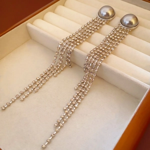 Elegant long pearl drop earrings with sparkling silver tassel fringes for evening wear