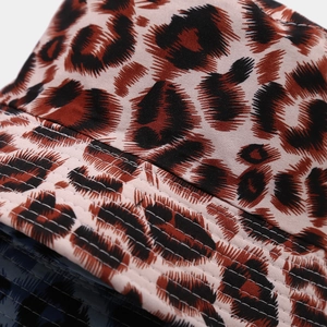 Double-sided leopard print bucket hat with reinforced stitching for outdoor sun protection