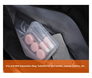 Close-up of waterproof dry-wet separation pocket in a black sports travel duffel bag