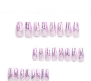 Detailed flat lay of lavender marble press-on nails with silver glitter accents
