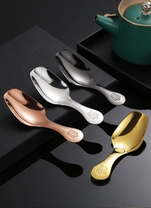 Detailed close-up of colorful 304 stainless steel tea spoons with mini crown handles