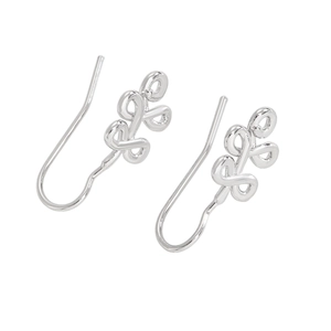 Macro detail of polished silver twist knot hoop earrings with artistic curved design