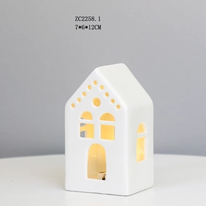 Detail view of ceramic house LED night light showing 7x6x12CM size and warm glow