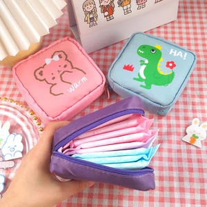 Cute cartoon sanitary napkin storage bags in pink, blue, and purple for girls