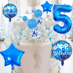 Blue number 5 foil balloon with star and confetti balloons on a party table set