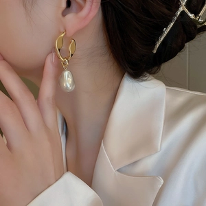 Elegant gold irregular metal hoop earrings with baroque pearl drop for women