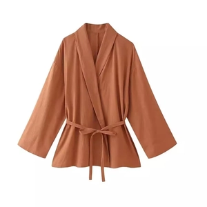 Burnt orange cotton linen jacquard kimono wrap top with matching belt on white background