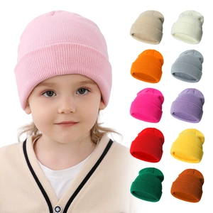 Comfortable soft knit children's beanie hat in various colors worn by a cute toddler