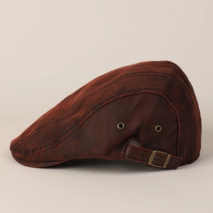 Detail view of vintage brown ivy cap featuring metallic side eyelets and adjustable rear strap