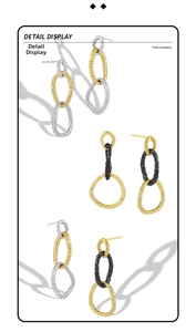Detail view of interlocking S925 silver rings with hammered texture and bicolor finish
