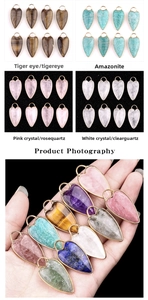 Detailed close-up of heart-shaped natural stone pendants with gold metal edge plating