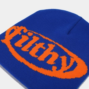 Macro shot of knitted beanie showing blue fabric texture and orange Filthy jacquard lettering