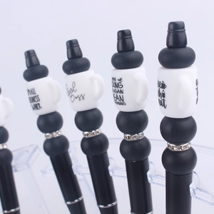 DIY black beaded pen with silicone coffee cup focal beads and funny slogan design