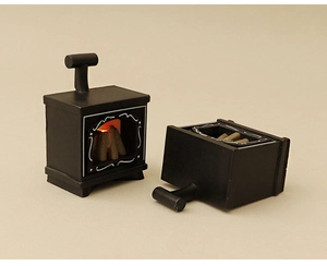 Close-up of black miniature dollhouse fireplace with realistic wood glow and LED effect