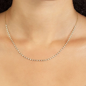 Close-up of elegant gold s925 silver necklace with sparkling colorful zircon stones