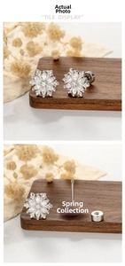 Detailed tile display of snowflake ear studs with cubic zirconia and screw back closures