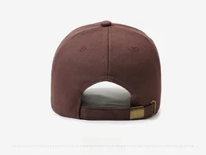 Rear view of brown cotton baseball cap showing adjustable antique bronze metal buckle