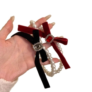 Elegant velvet bow necklace with pearls and rhinestones in red and black colors