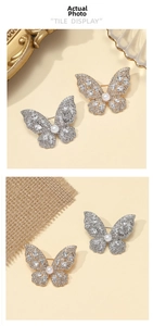 Detailed view of elegant butterfly brooch with inlaid rhinestones and a central white pearl