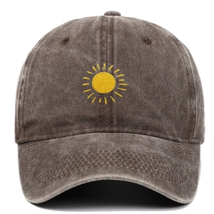 Detailed view of yellow sun embroidery on retro washed dark grey cotton baseball cap