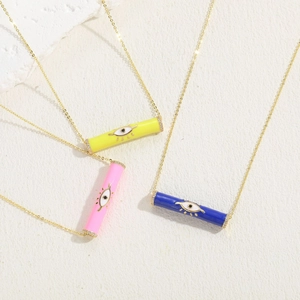 Detailed view of colorful evil eye barrel pendants in gold-tone necklace styles
