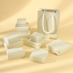 Elegant yellow-green jewelry gift box set with matching paper bags for rings and necklaces