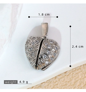 Detailed size specifications for heart wing pendant showing width and height measurements