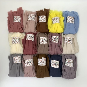Detailed grid of wrinkle cotton viscose scarves in 15 vibrant pleated bubble colors