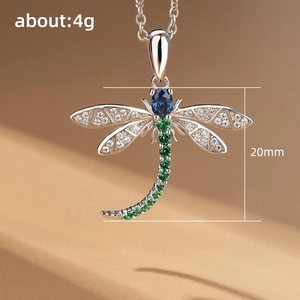 Elegant silver dragonfly pendant necklace with blue and green crystals for women
