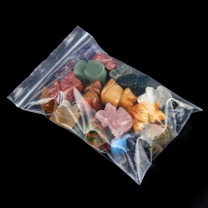 Mix of mini crystal rabbit figurines in a clear bag featuring various colorful gemstones