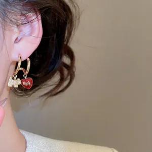 Gold-plated hoop earrings with zircon terrier dog and red enamel heart charms