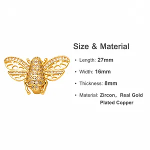 Macro shot of gold-plated bee pendant with cubic zirconia wings and detailed dimensions