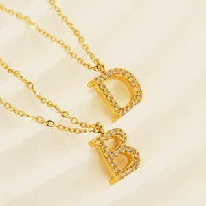 Minimalist titanium steel gold necklace with sparkling crystal initial D and B pendants