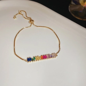 Close-up of gold plated rainbow crystal slider bracelet with adjustable box chain detail