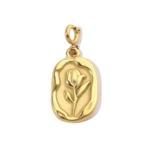 Macro detail of golden oval tulip relief pendant with stainless steel textured finish